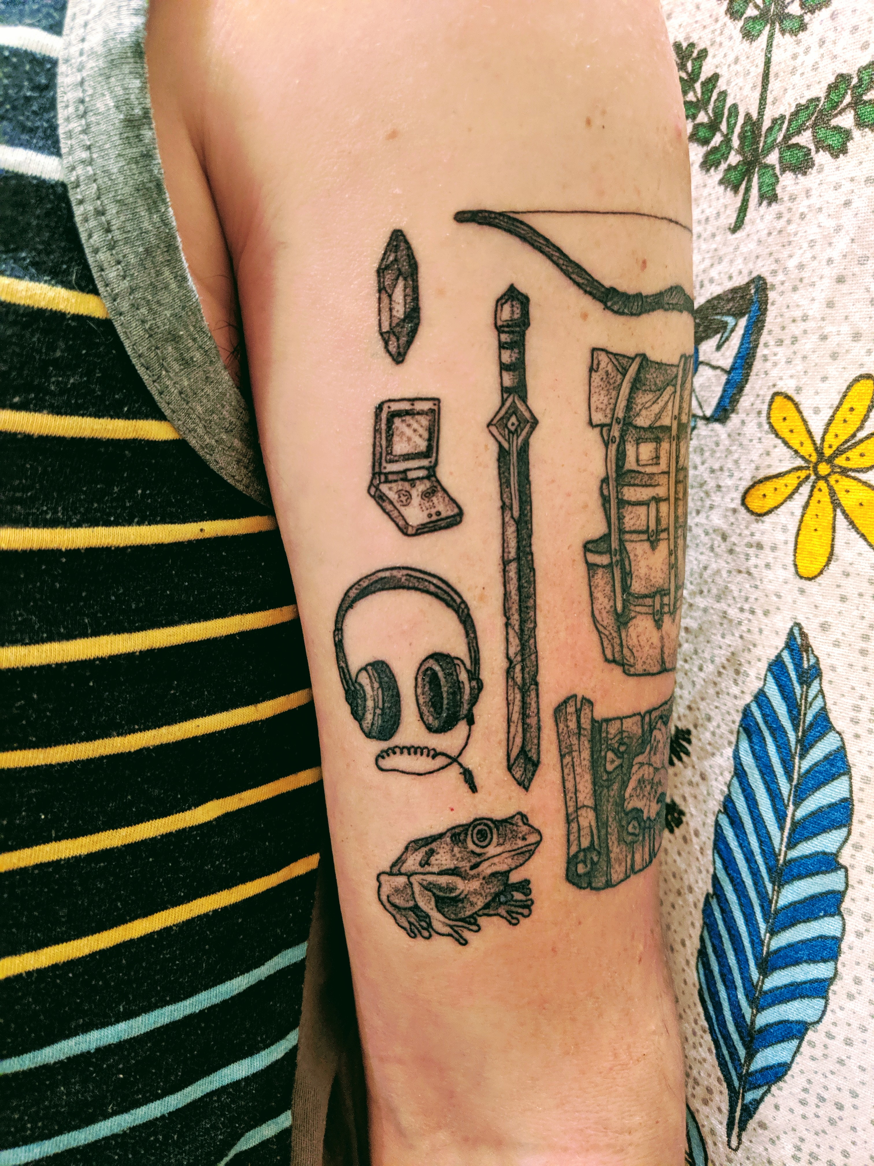Tattoo of small objects including a GBA SP